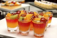 Small dessert glasses filled with kosher gelatin and fruit