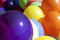 Turn pretty pastel-colored balloons into pacifiers for a baby shower.