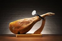 You can debone prosciutto using the same technique use to debone a regular ham.