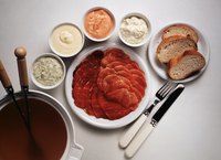 Heat broth in a fondue pot or electric wok.