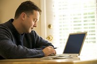 A man is doing online banking.