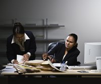 Women at desk doing paperwork