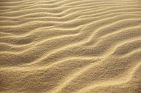 Sand creates dynamic contours that can be drawn with careful shading.