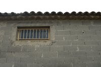 Making a window opening in a cinder block wall may require a sledgehammer.