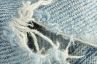 Fix torn jeans with a needle and thread.