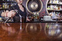 A bartender making a drink.