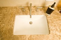 Use non-abrasive cleaners and solvents to remove dye from cultured marble.