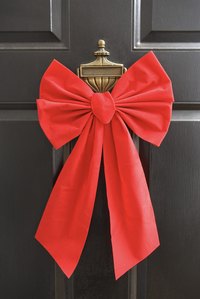 A big bow makes your door festive and welcoming.