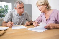 Small business owners going over debt capital market information