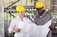 Factory managers discussing the process layout.