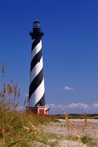 Make a whimsical yard lighthouse using basic craft supplies.