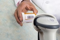 Scanning a UPC bar code on a pill bottle.
