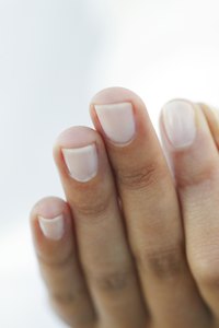 Prep your nails with a base coat before you apply your marble design.