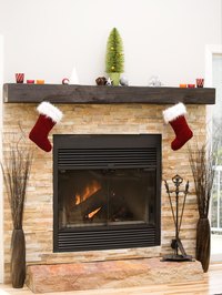 Drilling holes into your fireplace enables you to hang items from the brick.