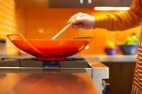 Keep the food moving in the wok so it cooks evenly.