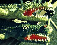 Use shades of green paint to create realistic looking scales on your mask.