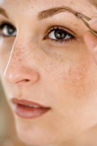 Remove errant hairs by thinning your eyebrows with tweezers.