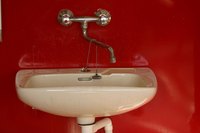 Porcelain sinks are susceptible to black marks from metal scrapes.