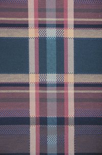 Tartan sashes display Scottish family pride.