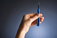 A seam ripper is a handy tool for removing appliques.
