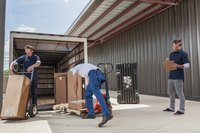 Company delivering goods to another company in back of a truck.