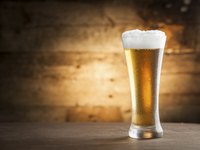 Glass of beer on a table.