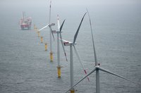 Turbines spinning in the water on a wind farm.