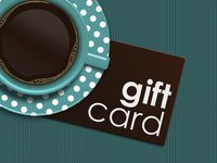 Gift card next to a cup of coffee