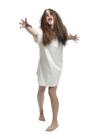 Use makeup to give your face an arms zombie pallor.