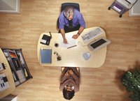 Looking down on two business people having a discussion.