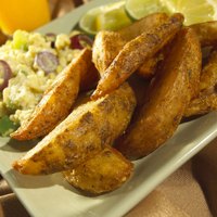 Slice russet potatoes into thick wedges for oven baked 'fries.'