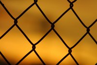 Roll up a chain link fence before disposing it.