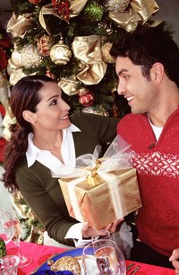 Polished sweaters in seasonal colors are appropriate for Christmas luncheons.