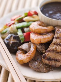 Colorful vegetables, tender meat and tang dipping sauce liven up teppanyaki platters.