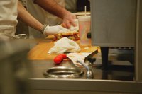 Chefs are cooking in a kitchen.