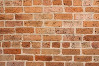 Putting an electrical box into brick requires some chiseling.
