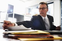 Business man looking at paperwork