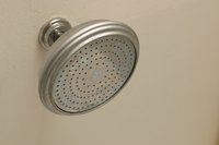Fix loose shower fixtures to avoid damage to the shower.