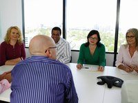 Business people having a discussion in a conference room.