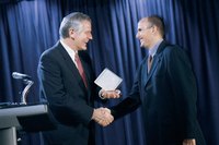 Shake the presenter's hand before making your speech.