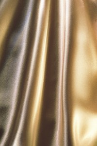 Lamé fabric is reflective and available in gold and other colors.