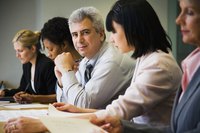 A group of business colleagues meeting in a conference room