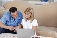 Couple looking at bills