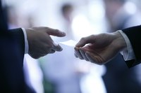 Hands exchanging business cards