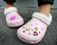 Close-up of Crocs on a little girl's feet.