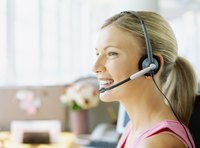 A telemarketing professional at work on the phone.