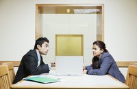 Two business people are having a serious discussion.