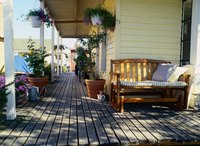 Install composite decking over a pressure-treated wood frame.