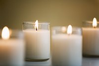 Close-up of white PartyLite candles.
