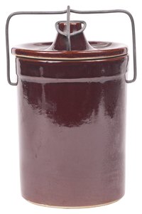 Crocks make versatile displays for everything from flowers to kitchen tools.